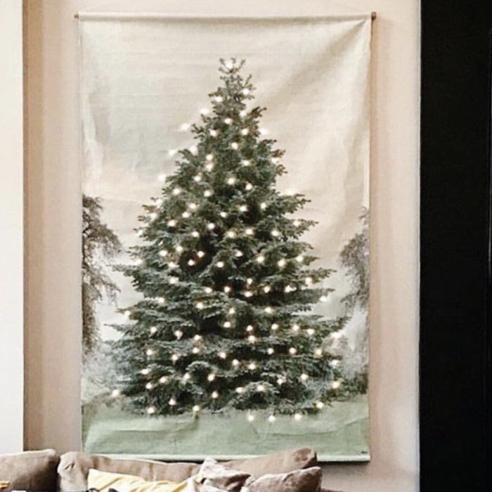 wall hanging of pine tree on printed cotton with led lights placed behind it