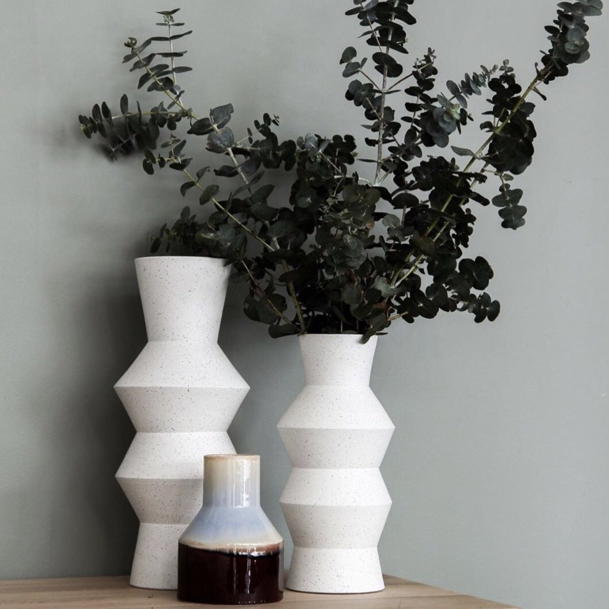 white vase together with brown blu vase