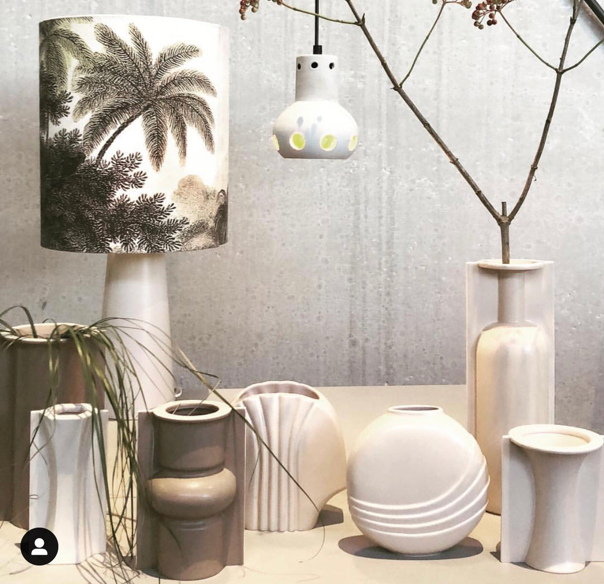 vases in clay tones with a table lamp with jungle print