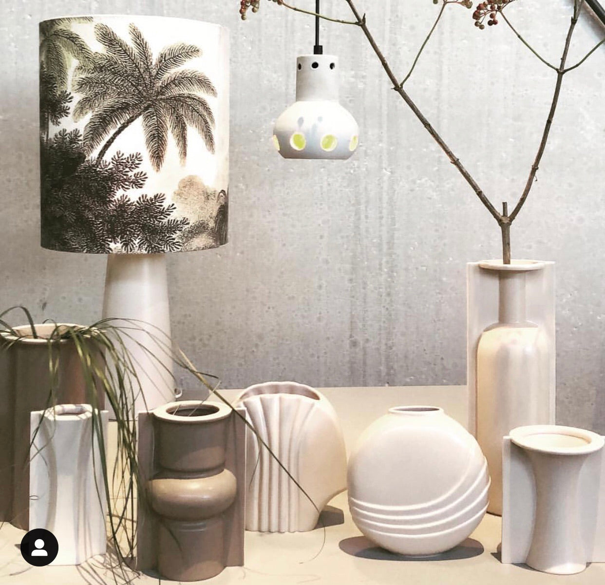 vases in clay tones with a table lamp with jungle print