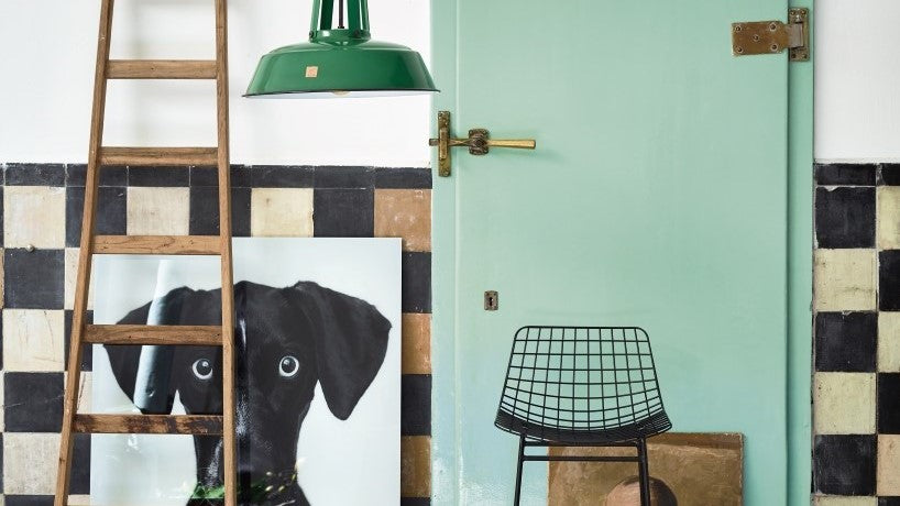 modern industrial style with green workshop lamp and metal bar stool
