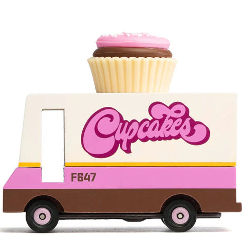 Toy truck with a cupcake on top and 'Cupcakes' written on it against a white background