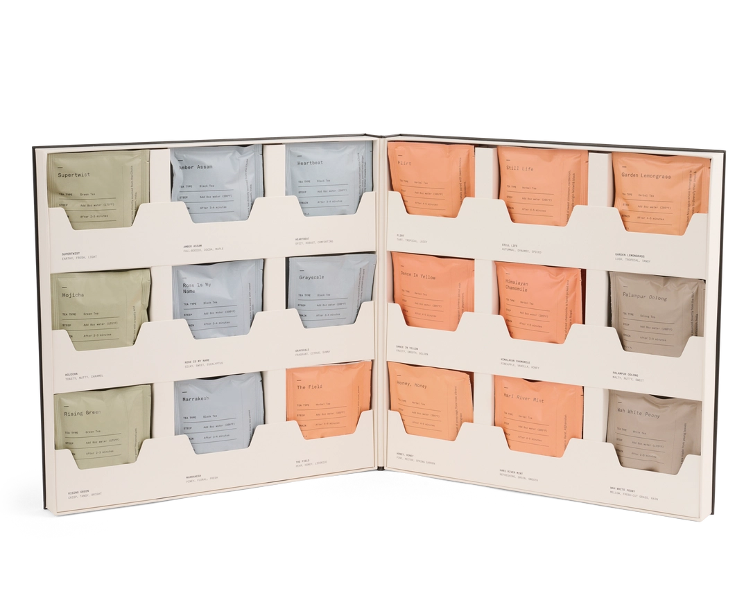 Set of tea bags in a display case with a white background