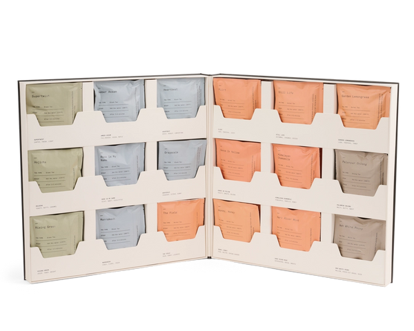 Set of tea bags in a display case with a white background