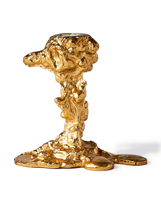 gold colored drip candle stick holder design object