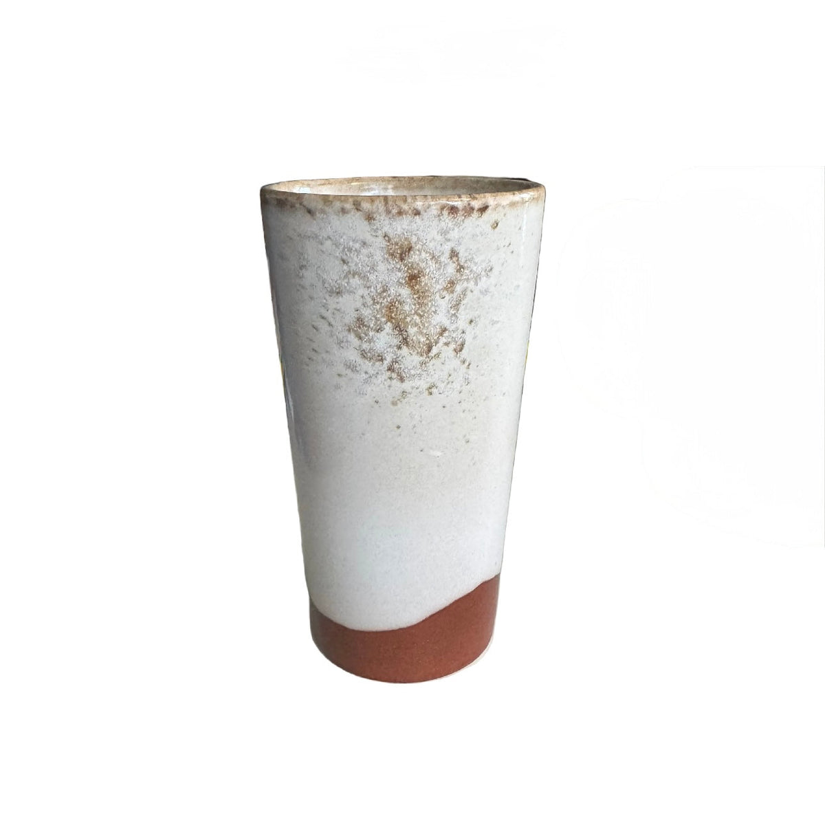 Ceramic tumbler with a rustic finish on a white background