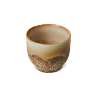 Ceramic cup with a gradient finish on a white background