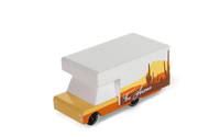Model of a truck with a white cab and orange trailer on a white background