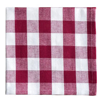 Red and white checkered fabric napkin on a white background