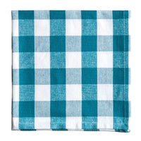 Teal and white checkered fabric napkin on a white background