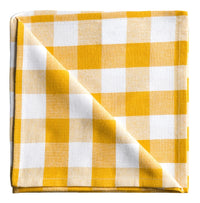 Yellow and white checkered fabric on a white background
