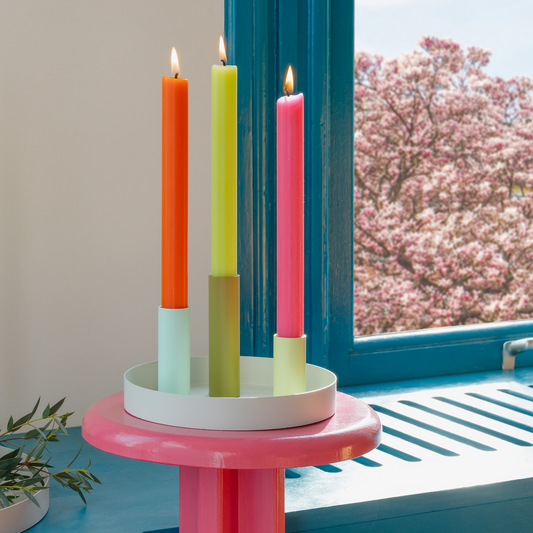 small magnetic tray with candle stick holders on pink side table