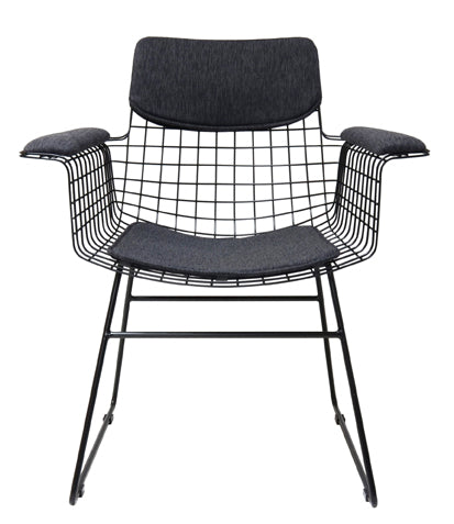 Modern chair with black wire frame and cushioned seat and armrests on a white background