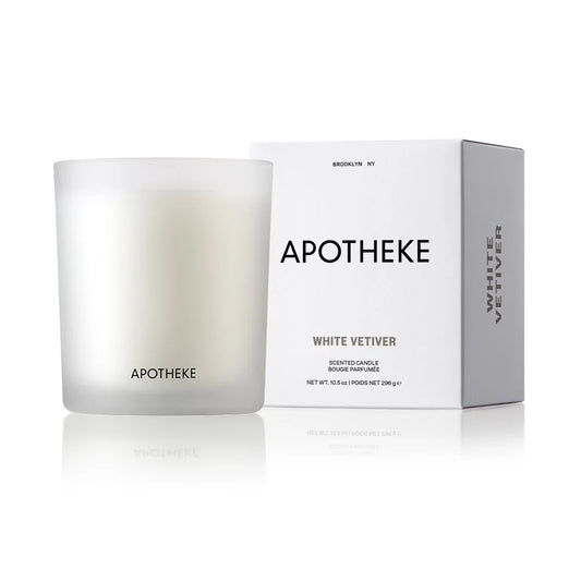 white vetiver scented candle in glass container