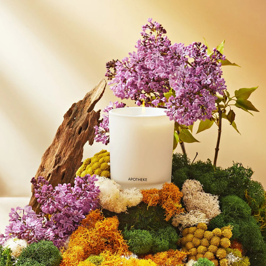 white vetiver scented candle in glass container