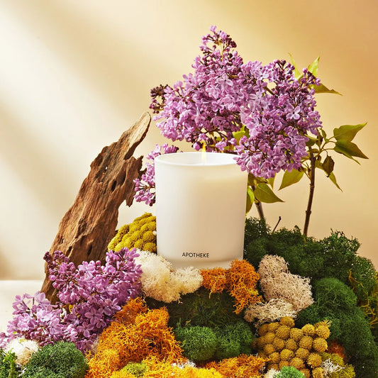 white vetiver scented candle in glass container