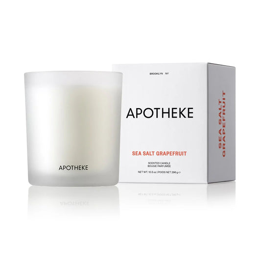 white glass vessel with sea salt grapefruit scented candle