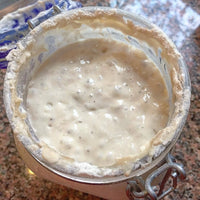 Bowl with a creamy mixture on a textured surface