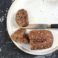 ceramic breakfast plate with dark multigrain bread