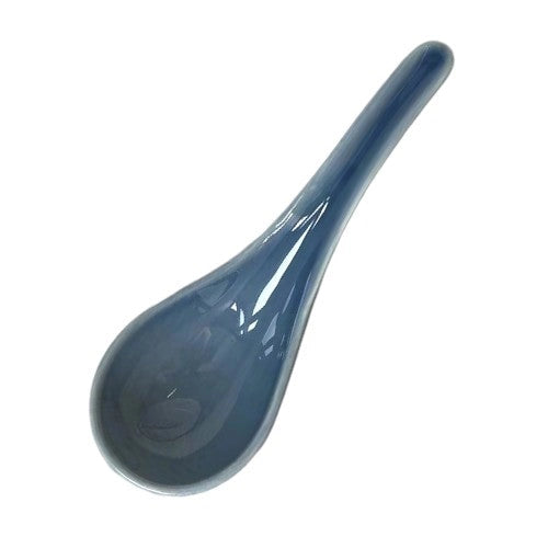 Blue ceramic spoon on a white background
