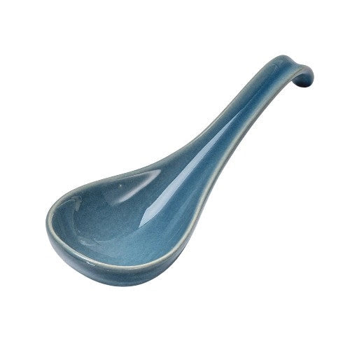 Blue ceramic ladle on a white background