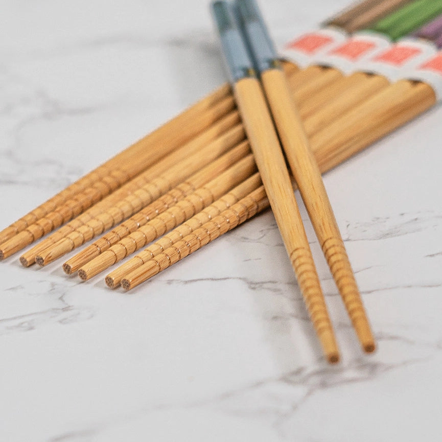 Set of wooden chopsticks on a marble surface