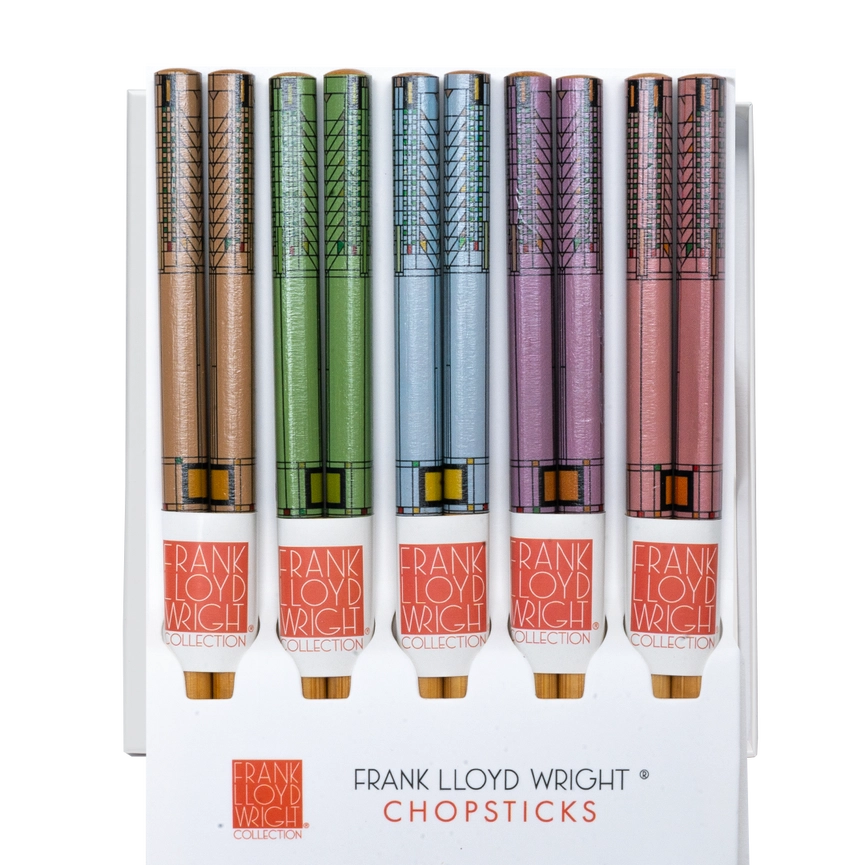 Set of Frank Lloyd Wright chopsticks with colorful handles on a white background