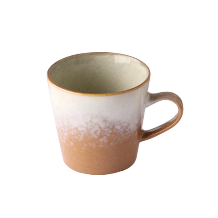 Ceramic mug with gradient design on a white background