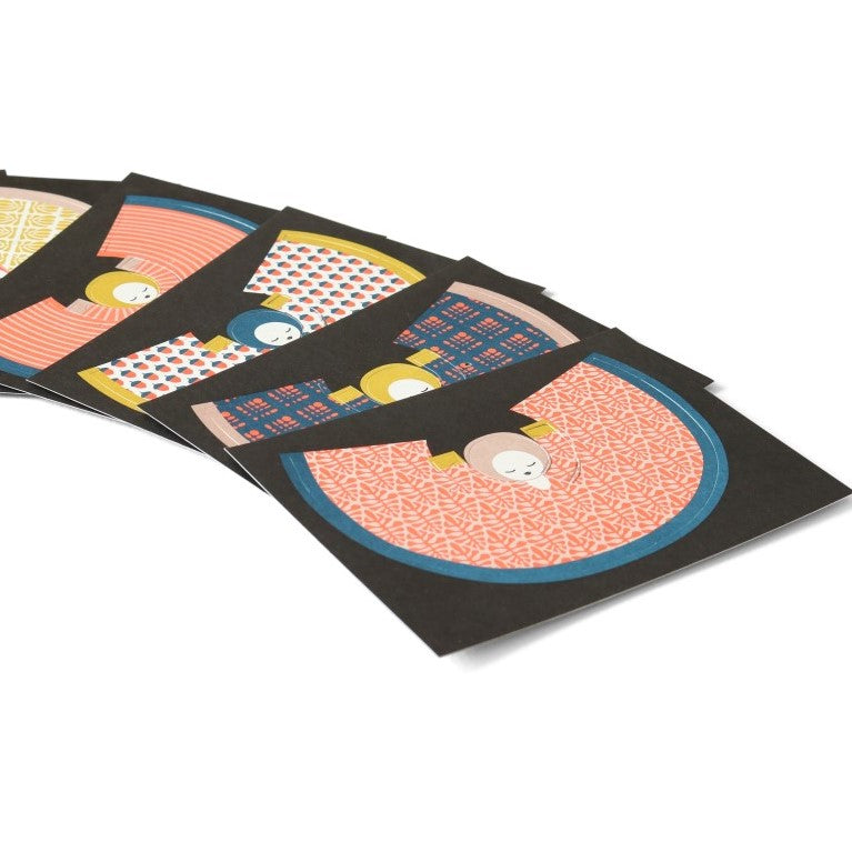 Set of colorful greeting cards with abstract designs on a white background