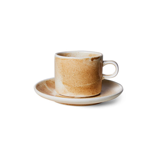 cream and brown cup with saucer