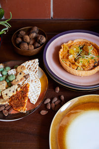 brown and cream stoneware retro style dinner plate with food
