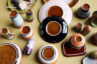 table with retro style dinnerware seen from the backside