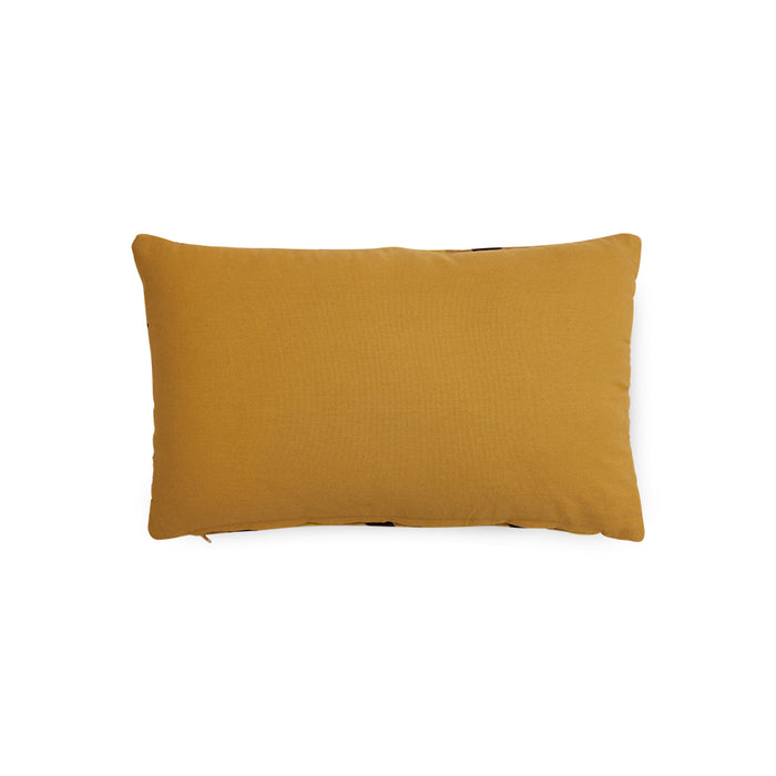 backside of caramel toned velvet lumbar pillow