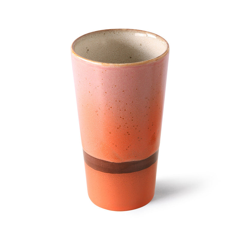 Ceramic tumbler with a two-tone design on a white background