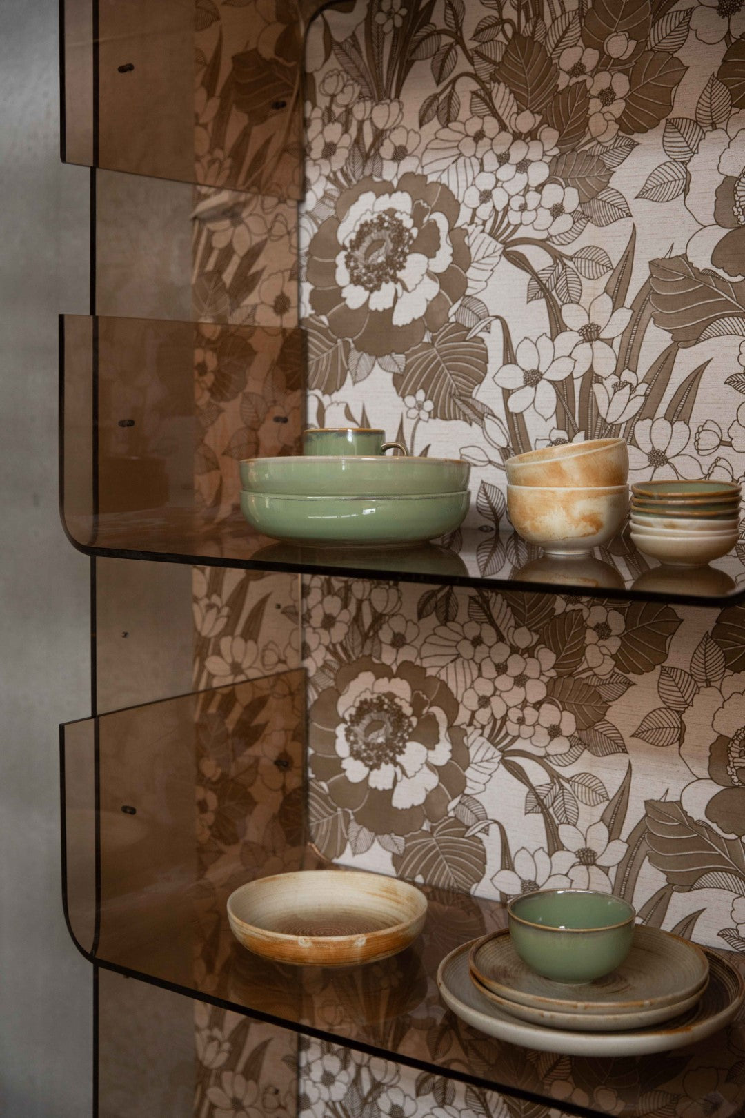 open shelving with rustic cream brown and green deep plates and bowls