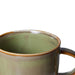 detail of moss green mug with ear