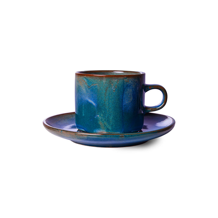 cup and saucer made from porcelain with a rustic blue glazed finish