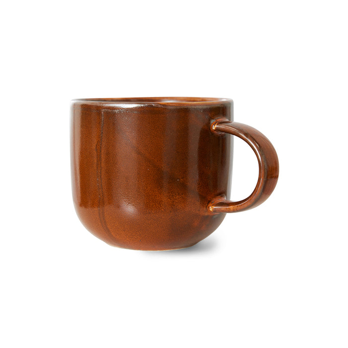 orange brown ceramic mug with ear
