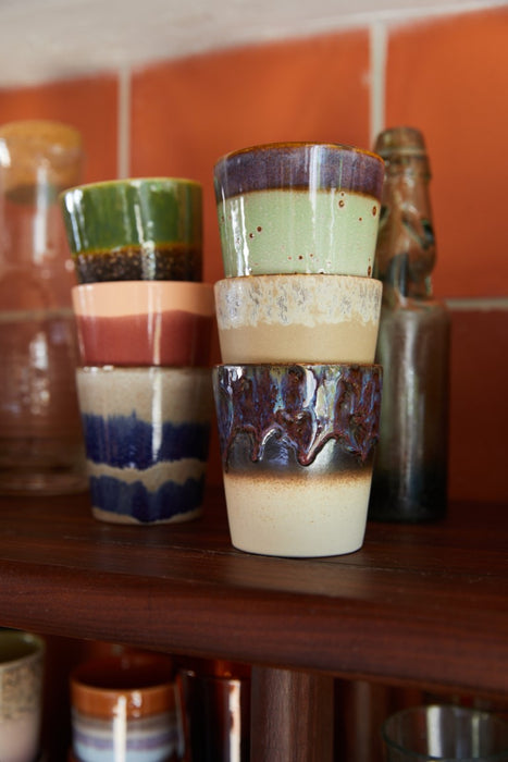 6 retro style glazed tumbler coffee cups on a wooden shelf
