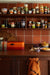 retro style kitchen with orange bread box and stoneware 70s ceramics cups and plates