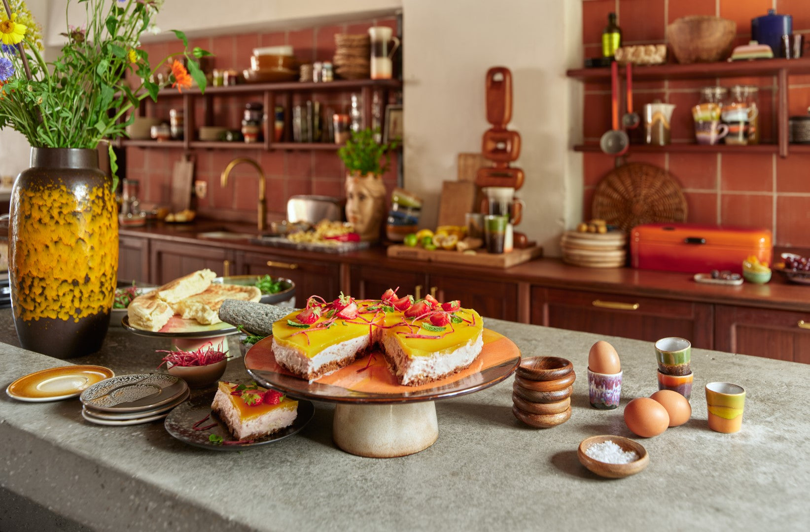 retro style kitchen with cake stand, egg cups and dessert plates