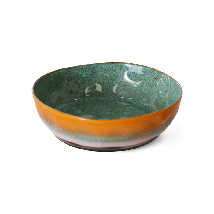 deep pasta plate with green glaze inside and orange pink and green glaze outside of bowl