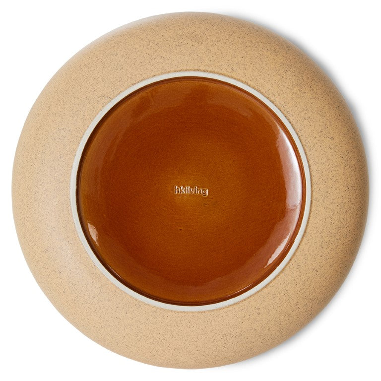 sand yellow  and orange colored bottom of ceramic servng bowl with hkliving logo