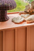detail of top of modern credenza in blush color