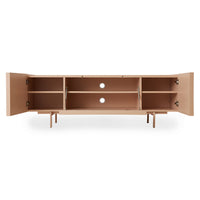 inside of blush pink colored entertainment center sideboard