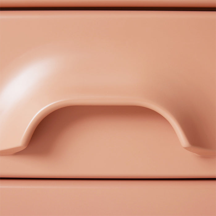 detail of blush colored 2 drawer cabinet