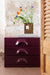 small cabinet with 3 drawers in deep purple color