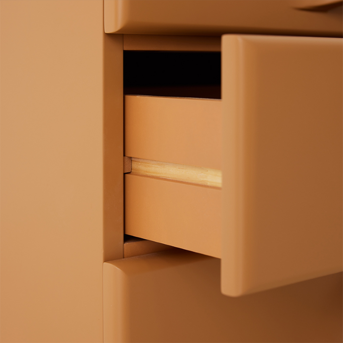 detail of ginger orange chest of 3 drawers
