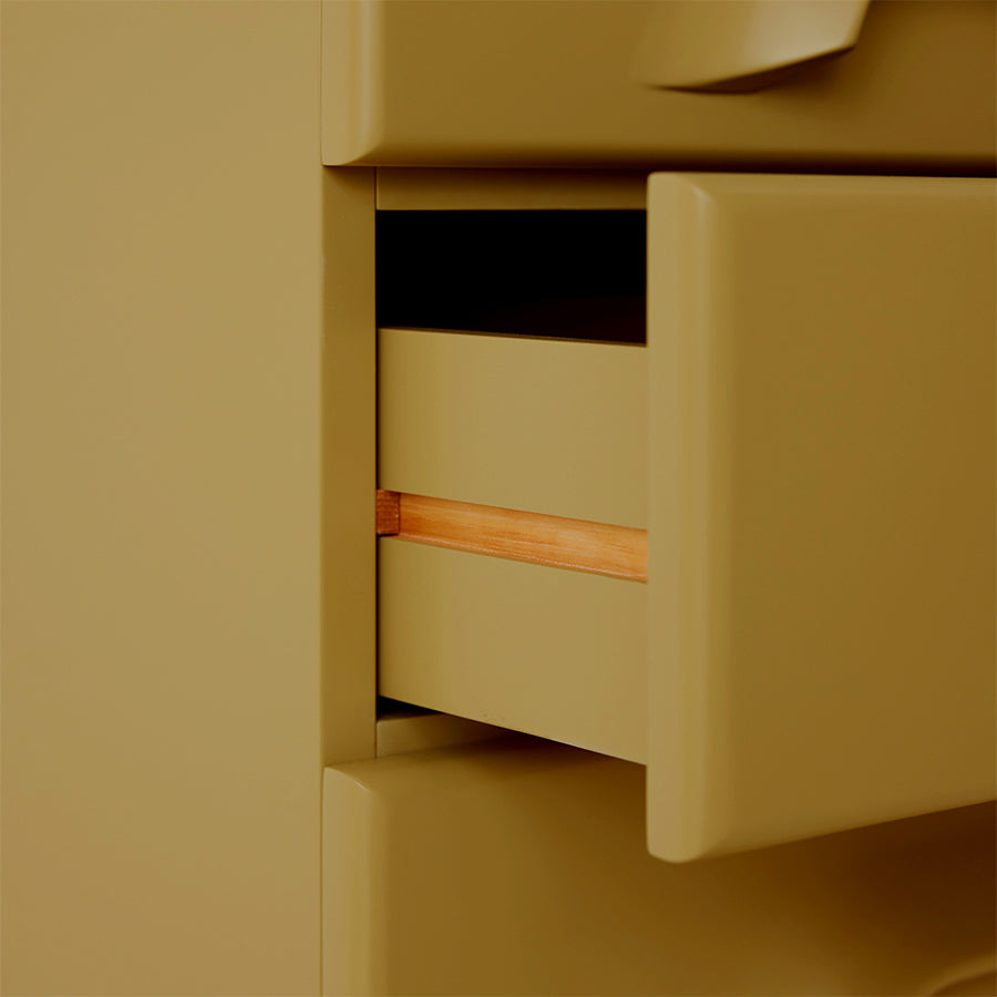 detail of sage green cabinet with 6 drawers