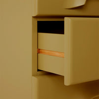 detail of sage green cabinet with 6 drawers